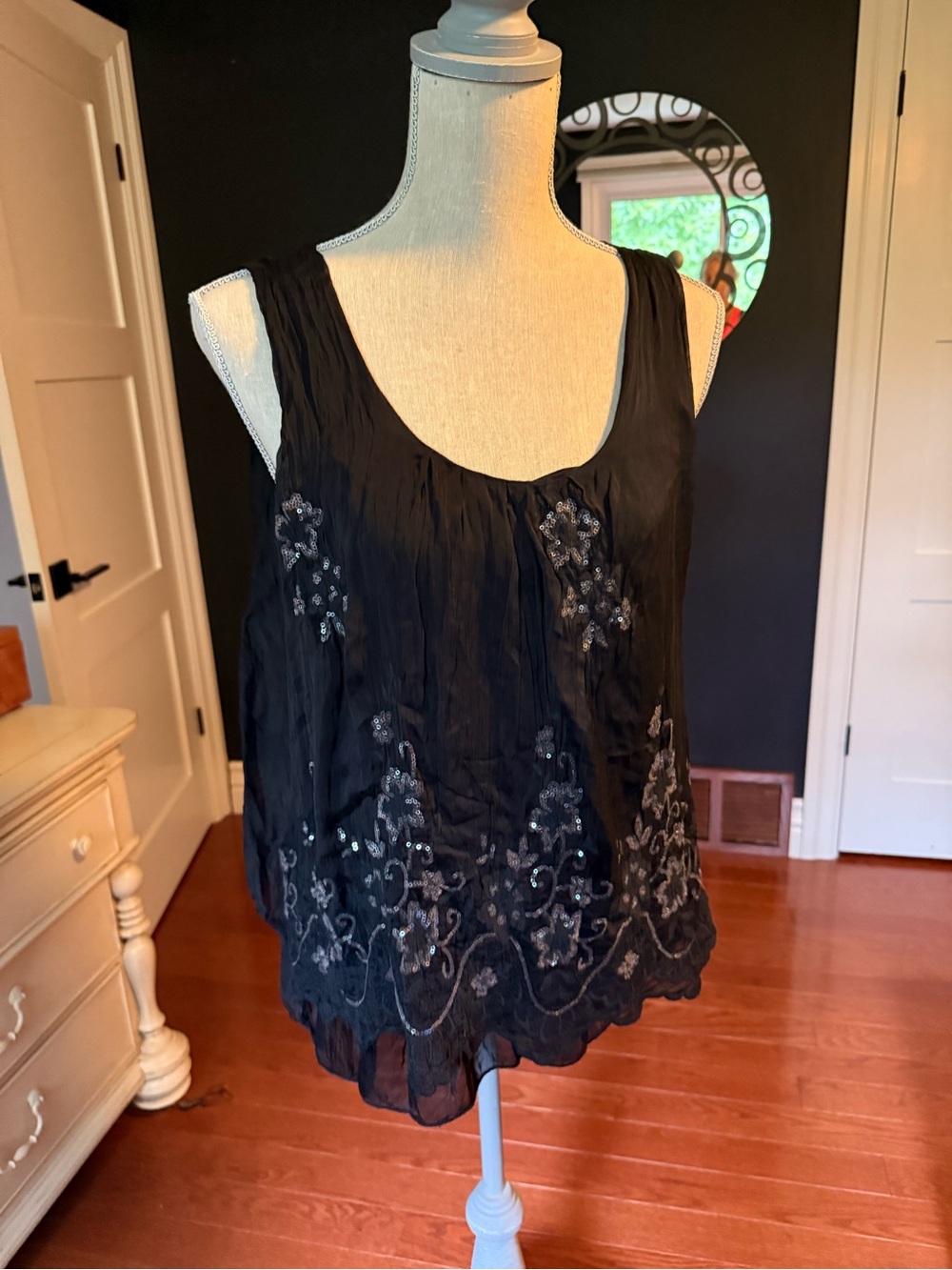 Black feminine sleeveless ladies top with floral sequin motif